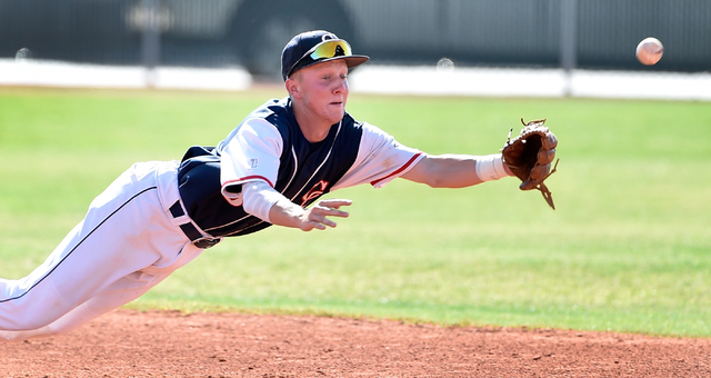 Coronado High School shortstop Jordan Dalrymple dives for the ball during a first round game ...