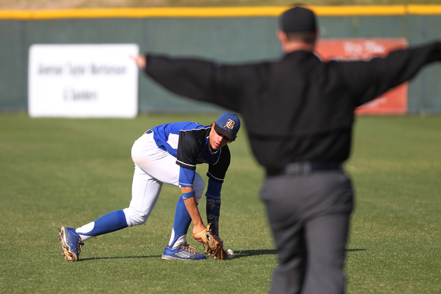 Basic’s Cory Wills (2) drops a fly ball in the outfield in the second inning of their ...