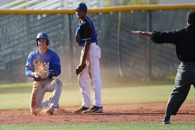 Green Valley’s Gavin Morley (10) beats a tag by Basic’s Garrett Giles (17) for a ...