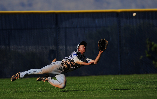 Shadow Ridge left fielder Bryson Barnes makes a diving catch to rob a Centennial batter of a ...