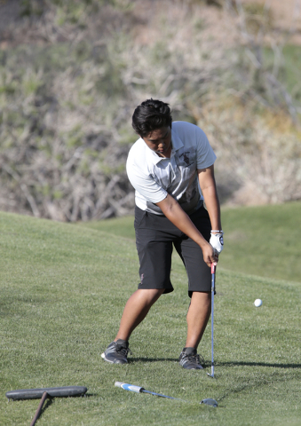 Desert Oasis High School’s Syouta Wakisaka, hits a chip shot during the final round of ...