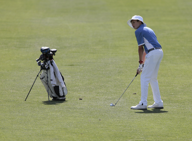 Green Valley High School’s Ty Klabacka, looks down the course before making his swing ...