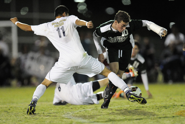 Shadow Ridge striker Alejandro Pacheco (11) defends Palo Verde striker Nolan Sherwood (10) d ...