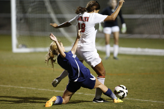 Shadow Ridge’s Lindsay Irwin (4) reaches to try to poke the ball away from Arbor View& ...