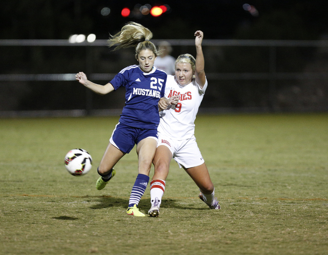 Shadow Ridge’s Danika Shupe (25) and Arbor View’s Jessica Longhurst (9) battle f ...