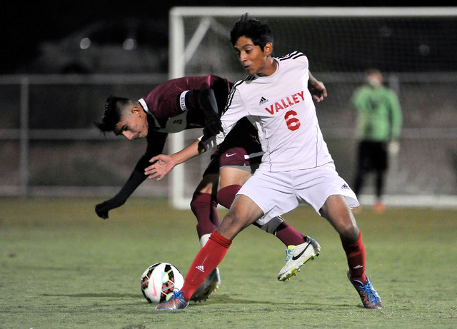 Valley’s Juan Velazquez (6) and Eldorado’s Eddie Mercado vie for the ball during ...