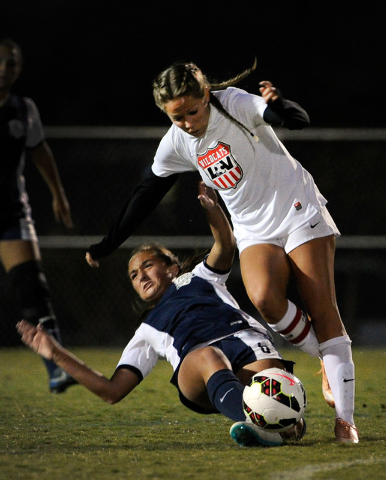 Foothill’s Katherine Ballou and Las Vegas’s Kara Bowden vie for the ball during ...