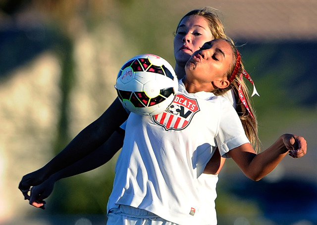 Foothill’s Casey Welch, left, and Las Vegas High’s Ashlee Jordan vie for the bal ...