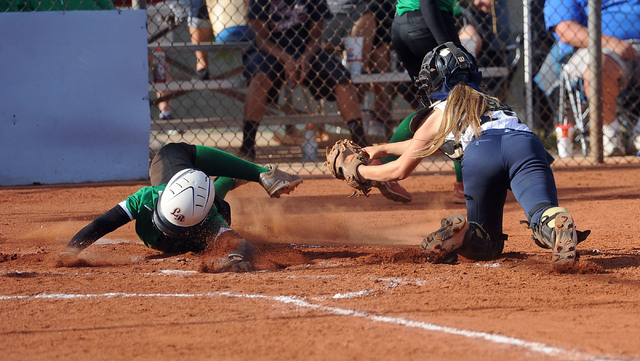 Rancho’s Jahnae Davis-Houston, left, slides around the tag of Foothill catcher Hannah ...