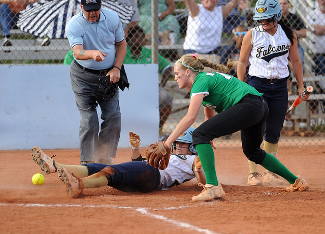 Rancho pitcher Samantha Pochop, right, drops the ball, allowing Foothill’s Katelyn Enz ...