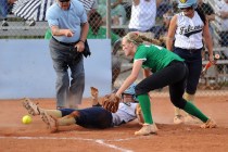 Rancho pitcher Samantha Pochop, right, drops the ball, allowing Foothill’s Katelyn Enz ...