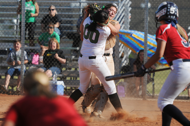 Rancho’s Kayla Coles (00) collides with her teammate McKinzi Vega (1) as she makes a c ...