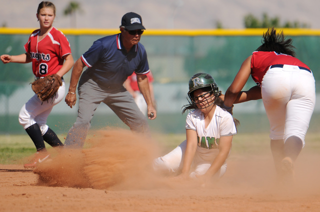 Rancho’s Sammi Llamas (9), center, beats the tag by Jaiden Johnson (14) at second base ...