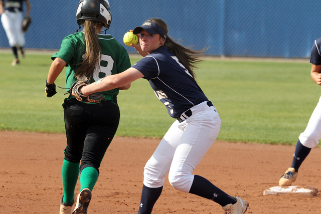 Shadow Ridge sophomore Samantha Milanovich throws to first base after tagging out baserunner ...