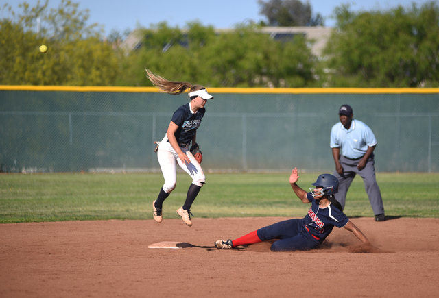 Coronado’s Jaiden Johnson (11) slides into second base against Foothill’s Kylie ...