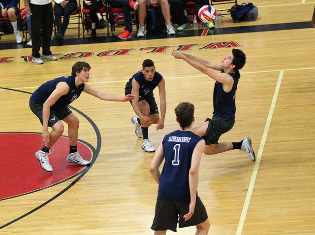 Legacy’s Jonah Tarlton, right, receives the ball from Arbor View as, from left, Trent ...