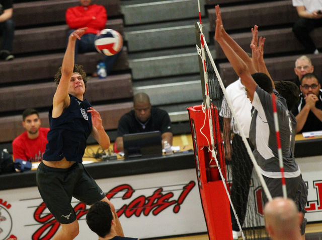 Legacy’s Trent Compton goes for a kill against Arbor View during a Sunset Region boys ...