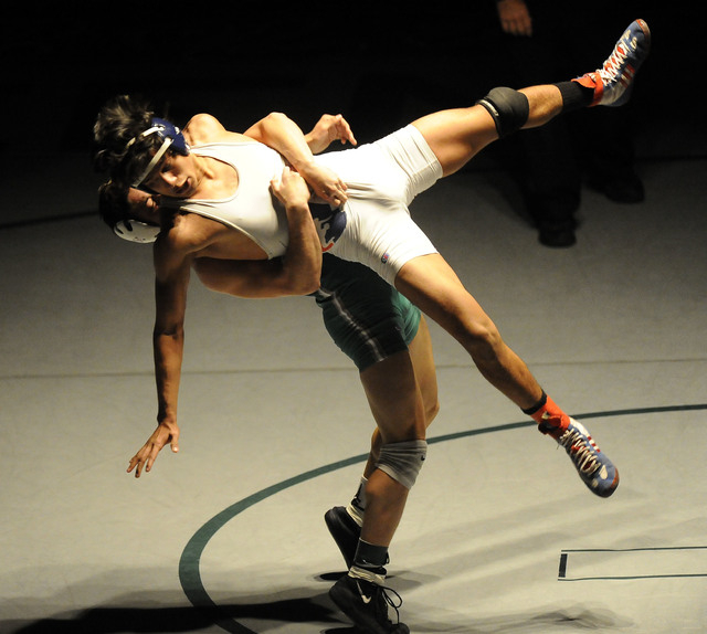 Green Valley’s Sean Cannon slams Liberty’s Michael Martinez to the mat during th ...