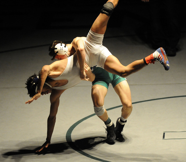 Green Valley’s Sean Cannon slams Liberty’s Michael Martinez to the mat during th ...