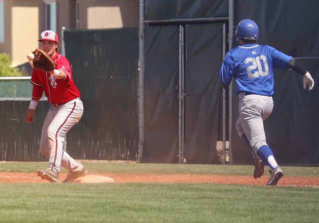 Arbor View’s Ryan McHale, left, catches the ball at first as Bishop Gorman’s Jor ...