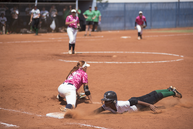 Foothill’s Sarah Maddox (12) catches the ball at first for an out against Rancho&#8217 ...