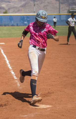 Foothill’s Sarah Maddox (12) scores on a two-run home run against Rancho during their ...