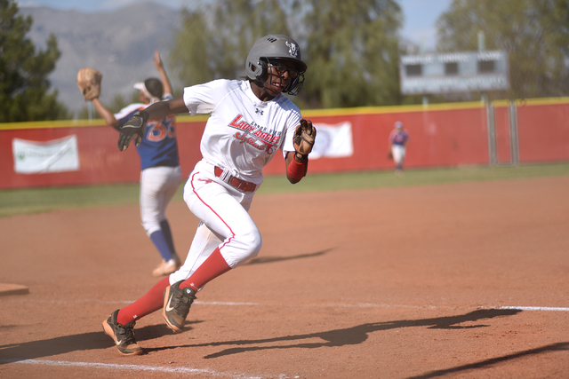 Arbor View’s Terren Vinson (13) runs towards home base for a score against Bishop Gorm ...