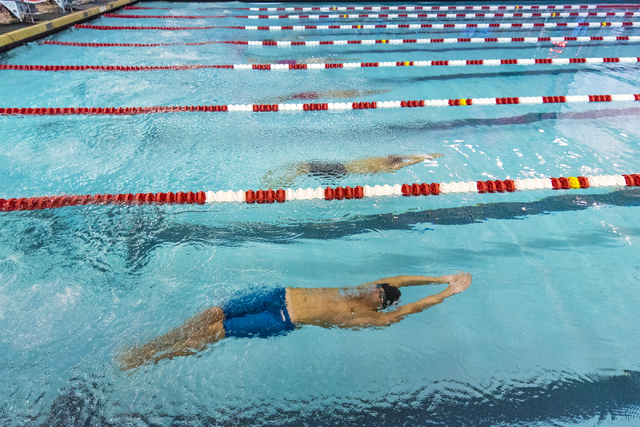 Swimmers compete during the Sunrise Region high school swim meet at the Bucky Buchanan Natat ...