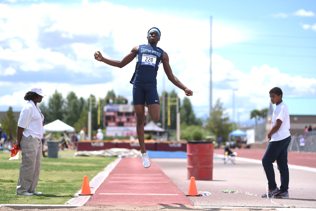 Canyon Springs Isaiah Johnson competes in the long jump event during the Division I region t ...