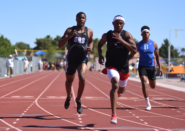 Las Vegas Tre James, center, wins first place in the boys 100-meter dash at the Sunrise Regi ...