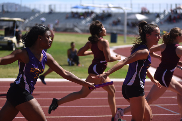 Durango’s Jamilah Rich-Manard, left, hands off the baton to teammate Zarina Felix duri ...