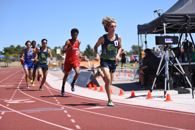 Green Valley’s Austin Rogers, right, leads in the 1,600-meter run at the Sunrise Regio ...