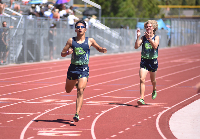 Green Valley’s Lenny Rubi, left, wins the 1,600-meter run at the Sunrise Region meet h ...