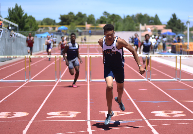 Legacy’s Jamal Britt, center, wins the 300-meter hurdles at the Sunset Region meet at ...