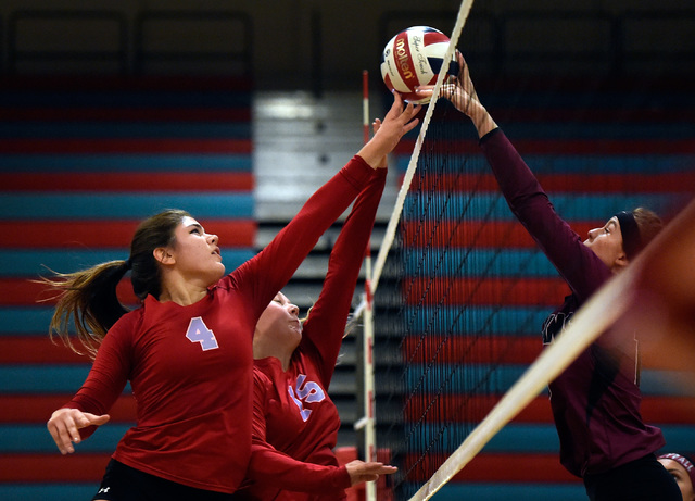 Western’s Elaina Tillmond (4) and Adrianna Jones goes for the ball against Pahrump Val ...