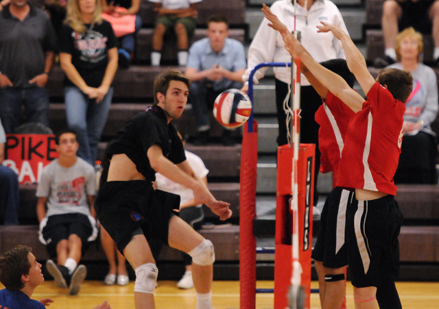 Las Vegas’ Chris Marx (8) and T.J. Esporas (2) block a spike ball from Valley’s ...