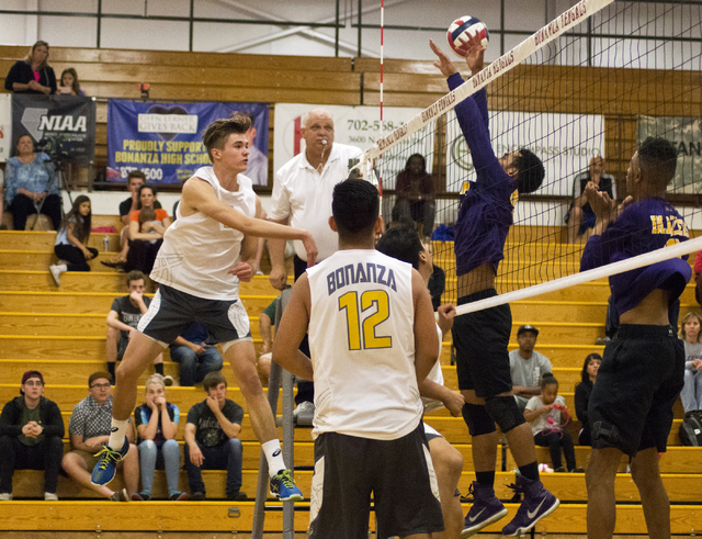 Bonanza’s Robby Adair (2) hits the ball through a block during the Sunset Region boys ...