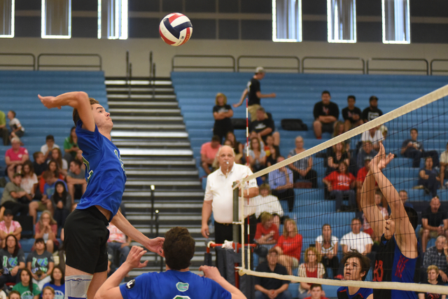 Green Valley’s Chase Larson (12) goes up for a spike against Valley during their volle ...