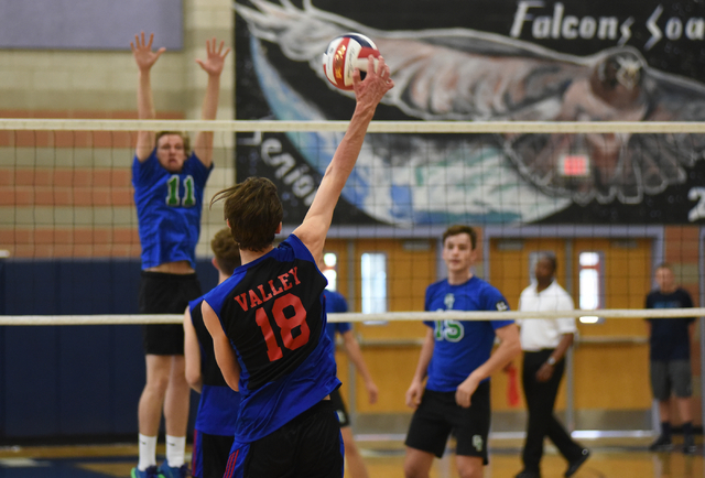 Valley’s Marty Heavey (18) hits the ball against Green Valley during their volleyball ...