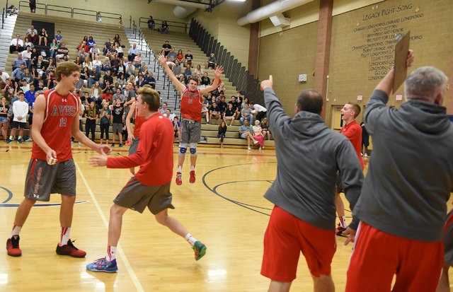 Arbor View High School’s volleyball team celebrates after defeating Palo Verde during ...