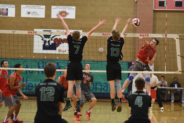 Arbor View’s Treven Clizbe (11) spikes the ball against Palo Verde’s Grant Tinge ...