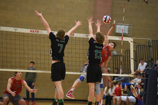 Arbor View’s Treven Clizbe (11) spikes the ball against Palo Verde’s Grant Tinge ...