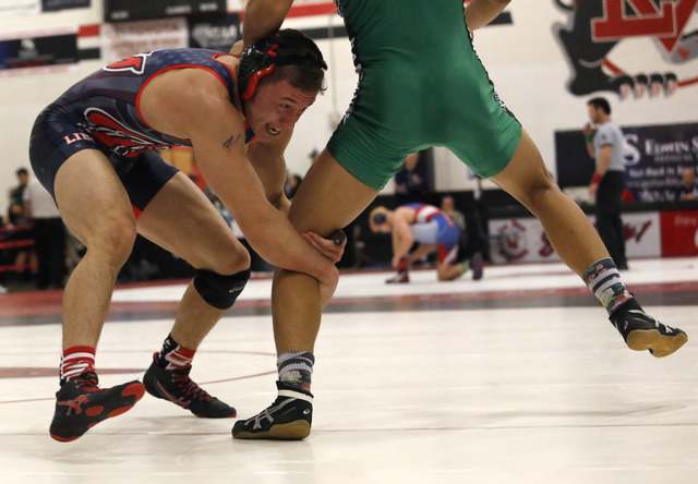 Liberty’s Michael Lancelot shoots a single against Rancho’s Luis Soto during a 1 ...