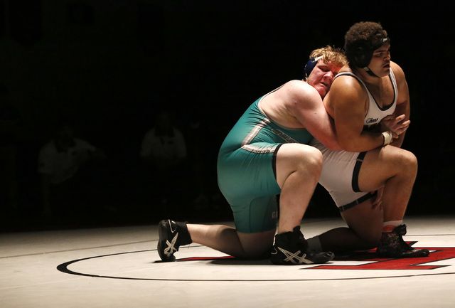 Green Valley’s Anthony Valenti, green singlet, wrestles Las Vegas’s Robert Keamp ...