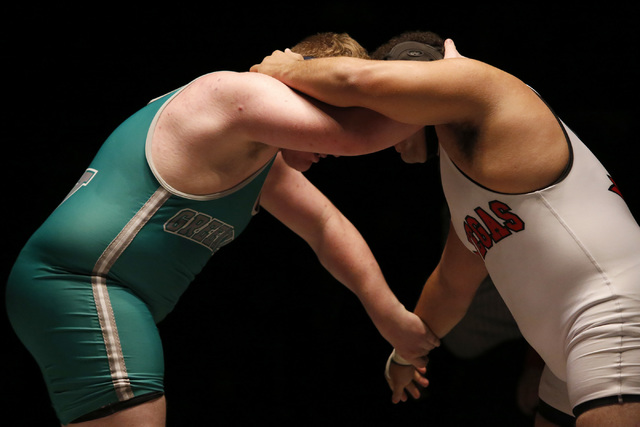 Green Valley’s Anthony Valenti, green singlet, wrestles Las Vegas’s Robert Keamp ...