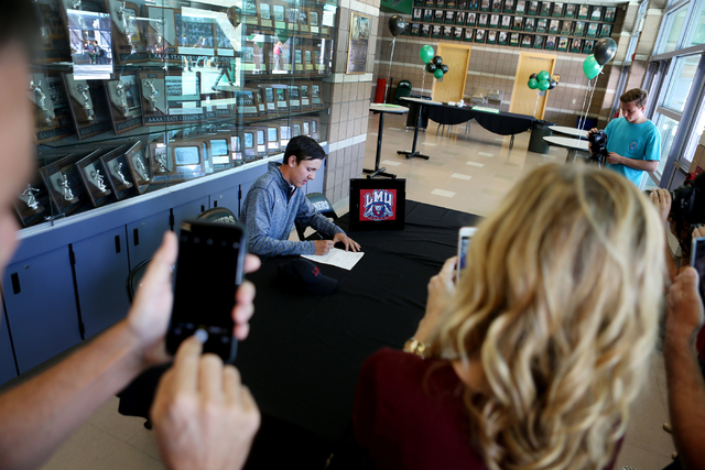 Palo Verde senior Cameron Meeks signs his paperwork for playing golf at Loyola Marymount Uni ...