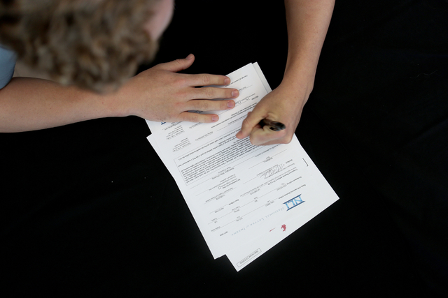 Palo Verde senior Dylan Orlando signs his paperwork for playing baseball at Washington State ...