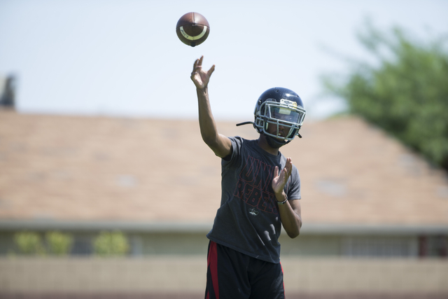 Tyrell Brooks makes a pass during a team football practice at Mountain View Christian High S ...