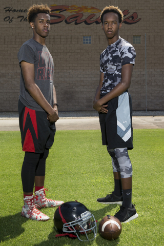 Tyrell Brooks, left, 16, is photographed with his twin brother Terrence during a team footba ...