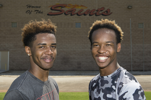 Tyrell Brooks, left, 16, is photographed with his twin brother Terrence during a team footba ...